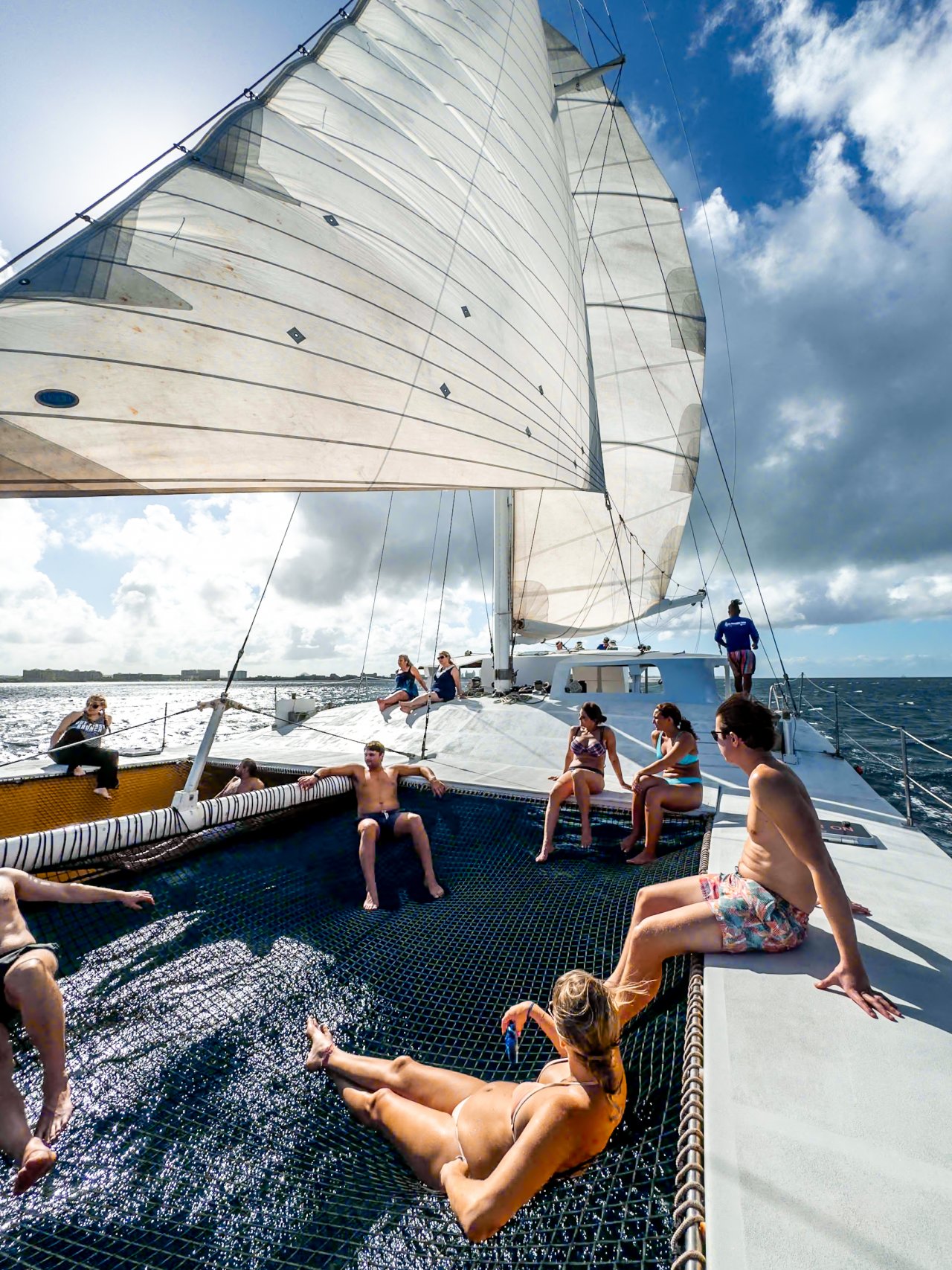 Catamaran deck with guests enjoying the ride